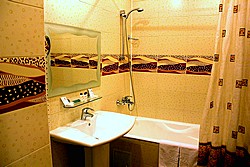 Standard Triple Room Bath Room at Maxima Zarya Hotel in Moscow, Russia